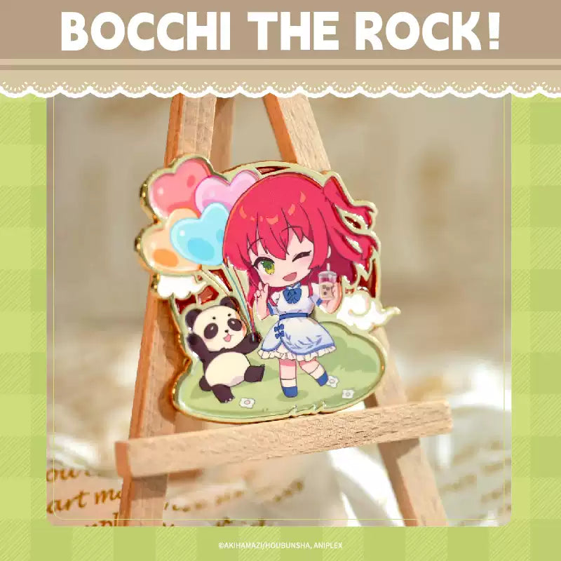 A China Limited metal pin badge of Kita from Bocchi the Rock!, she's in chibi form and wearing oriental cloth, with a panda beside her.