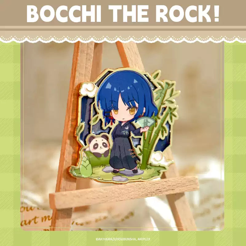 A China Limited metal pin badge of Yamada Ryo from Bocchi the Rock!, she's in chibi form and wearing oriental cloth, with bambo and panda around her.