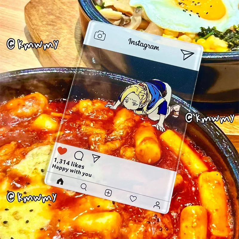 An acrylic transparent card featuring Delicious in Dungeon (Dungeon Meshi)'s Marcille in a comical pose—lying flat on the ground, desperately inhaling the scent of food with starry-eyed obsession. The card is playfully placed next to an aromatic dish (e.g., a sizzling steak or buttery pastry), creating the illusion that Marcille is literally fangirling over the meal. The translucent acrylic blends the artwork with the real food, enhancing the humor of her dramatic antics.