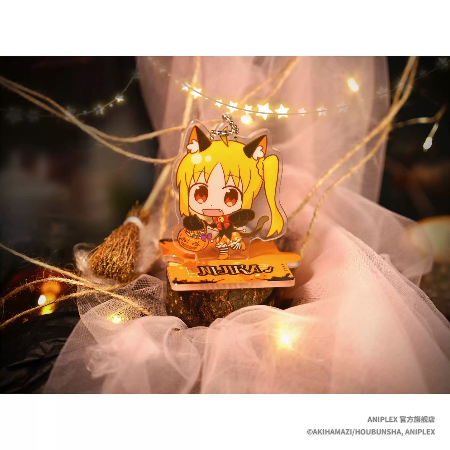 A Halloween theme acrylic mini stand of Bocchi the Rock! character Nichiji Ichika, she's wearing cat like cloth, with a pumpkin beside her