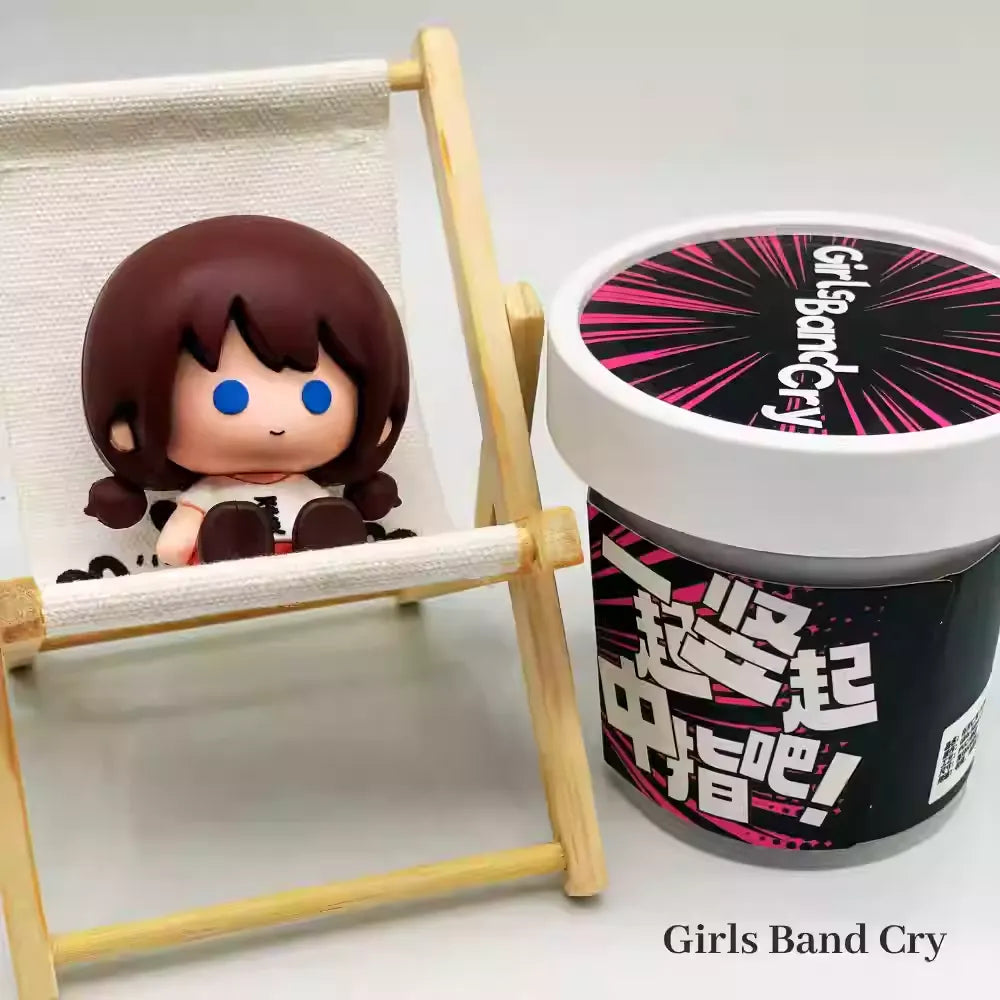A chibi-style PVC mini figure of Seri from Crying Girls Band, featuring an adorable two-heads-tall design with large, glossy dot eyes and a teary, pouty expression. The figure captures her signature outfit—likely her school uniform or band costume—in soft, pastel colors, with exaggerated tiny hands and stubby legs adding to the cuteness. The compact size and smooth PVC material make it perfect for desk displays or collection shelves.